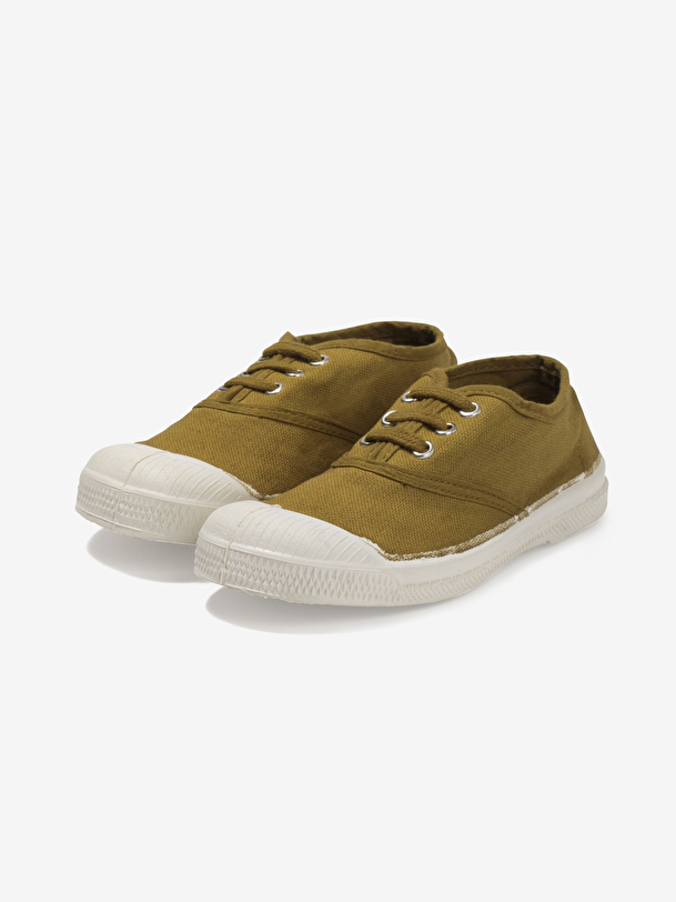 los niños cordones de tenis superávit