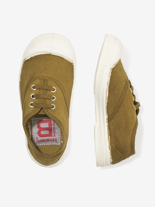 los niños cordones de tenis superávit