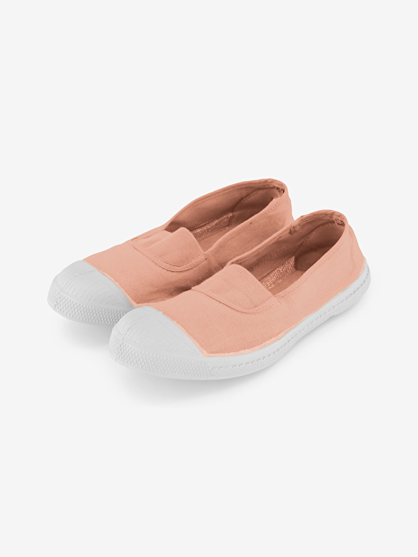 mujer elástica de tenis de color rosa