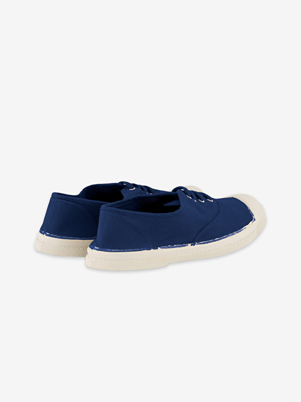 mujer de encaje-up de tenis indigo