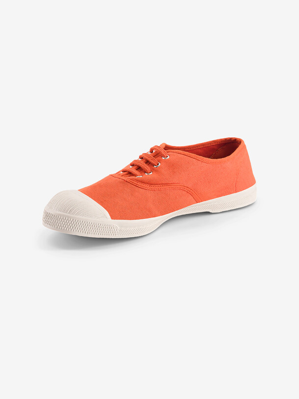 las mujeres cordones de los tenis de albaricoque